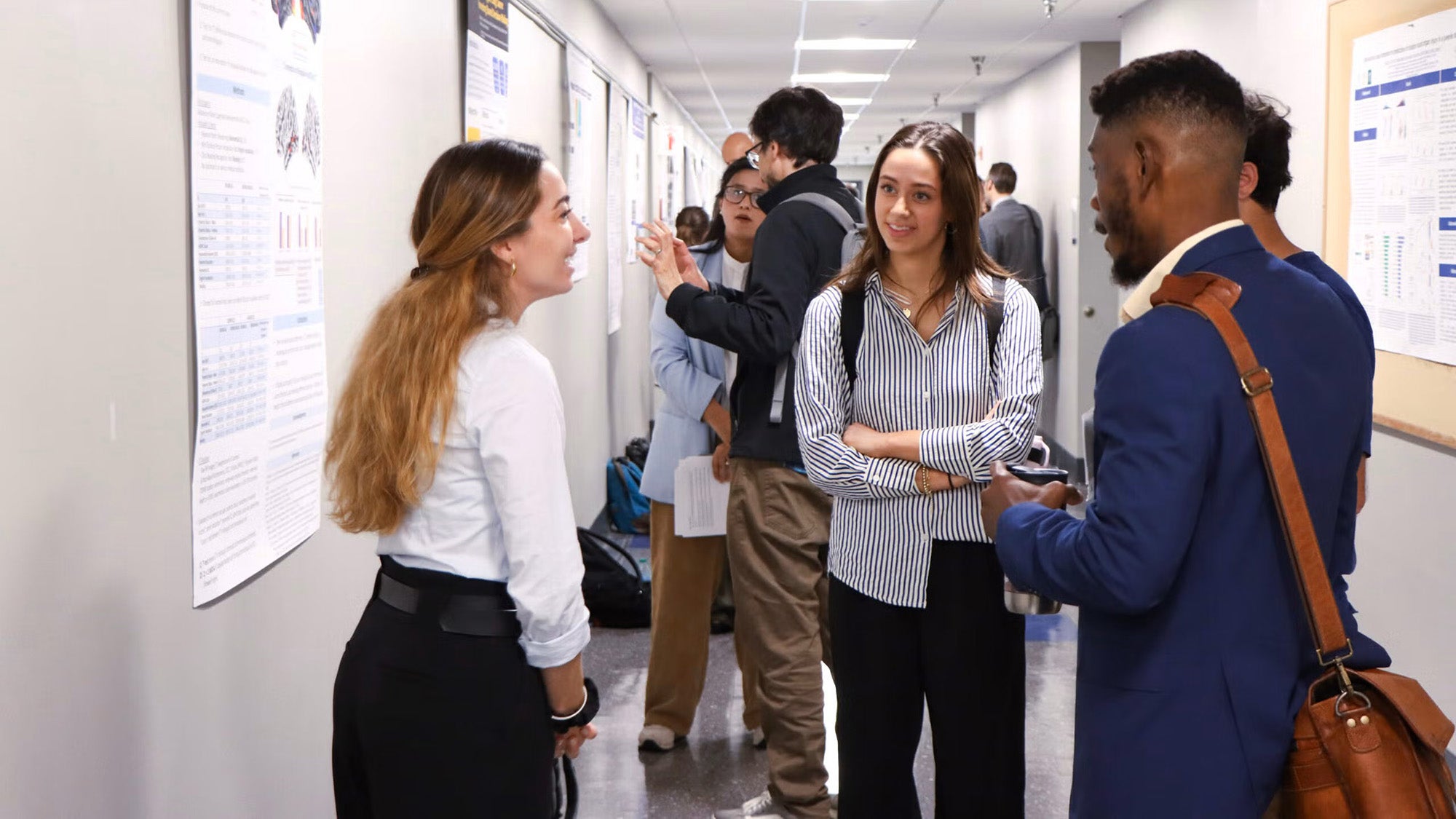 Four students interact during Student Research Day