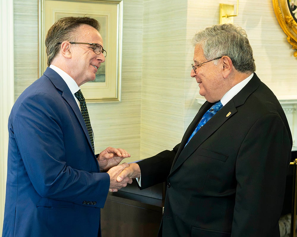 Norman Beauchamp shakes hands with Dr. Oppenheim