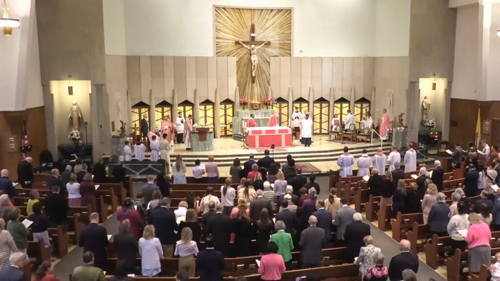 A view of the Rose Mass from above and behind the congregation