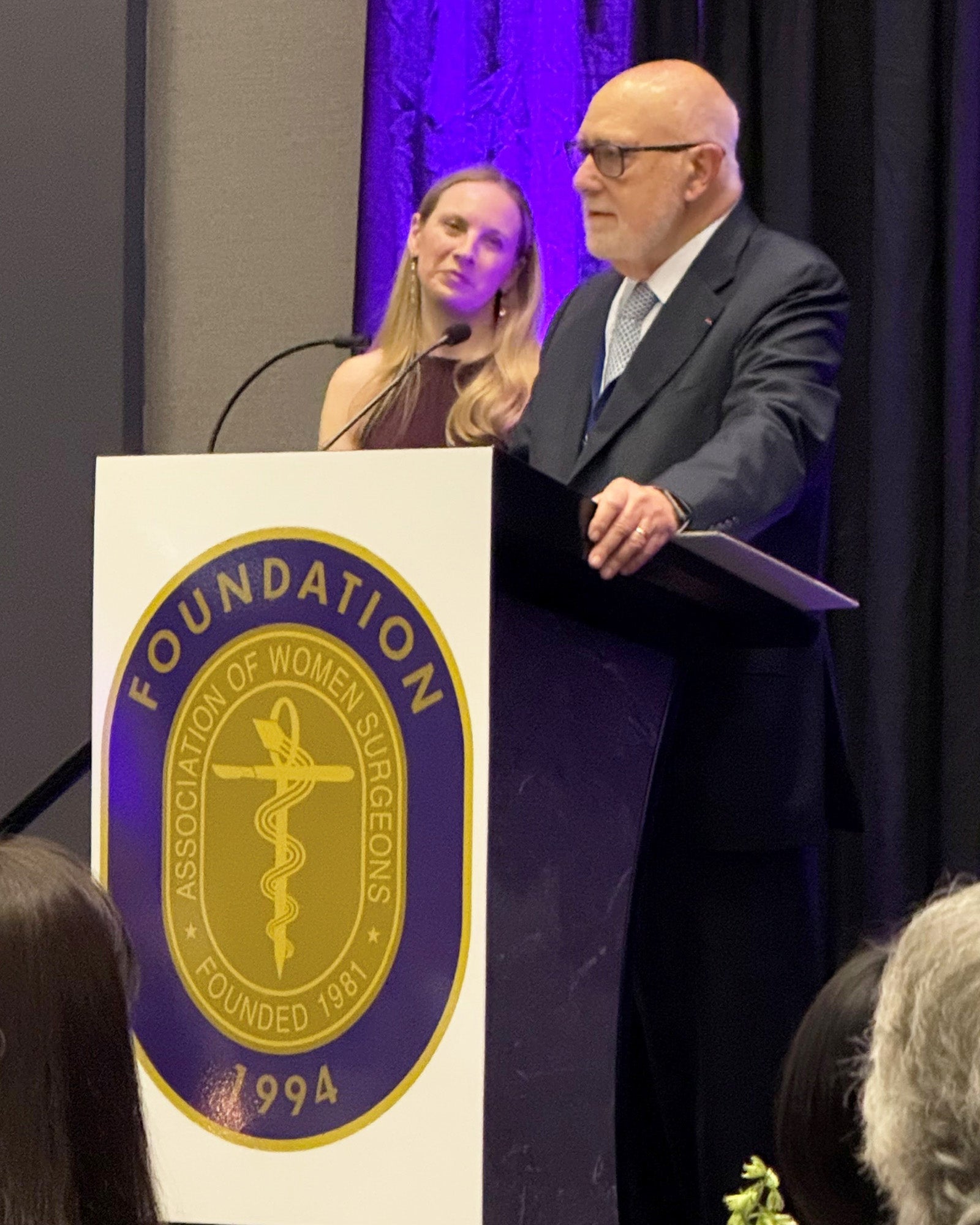 Carlos Pellegrini speaks from a podium 