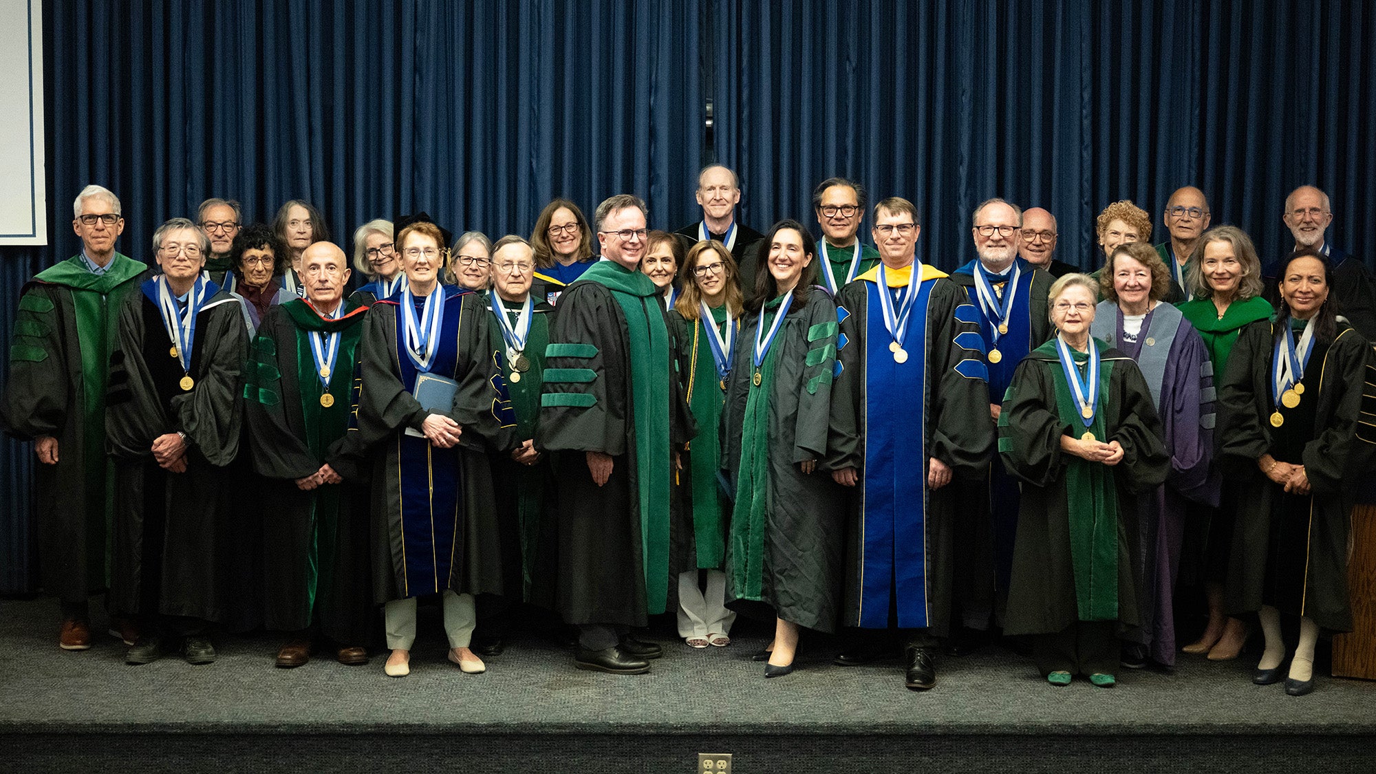 GUMC faculty members stand together in a large group