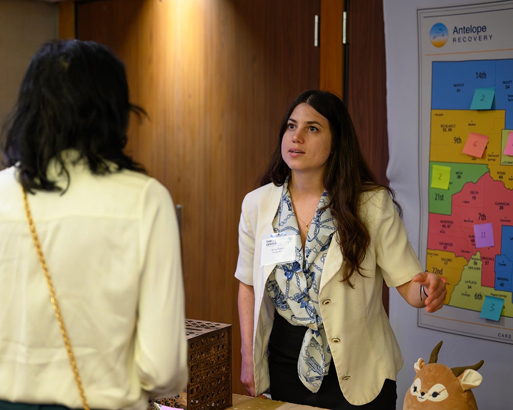 Katia Nikitina speaks to an attendee