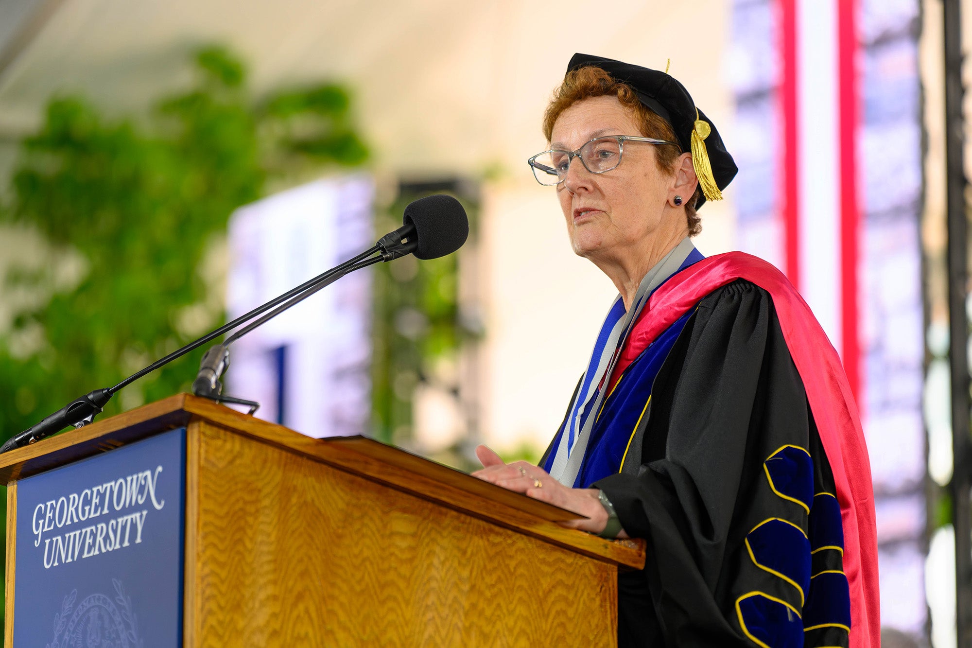 Anna Riegel speaks from a podium