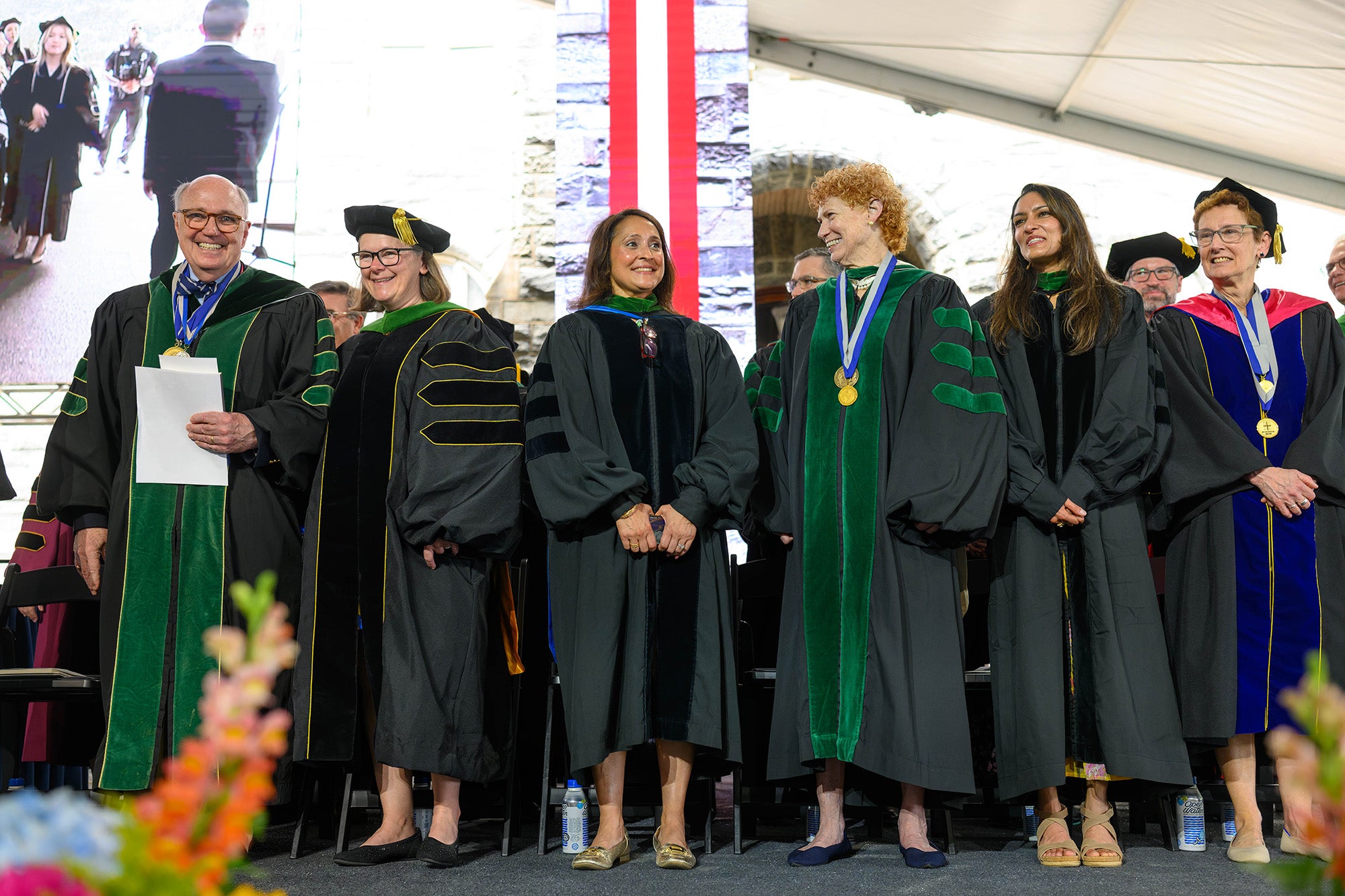 School of Medicine faculty stand together onstage