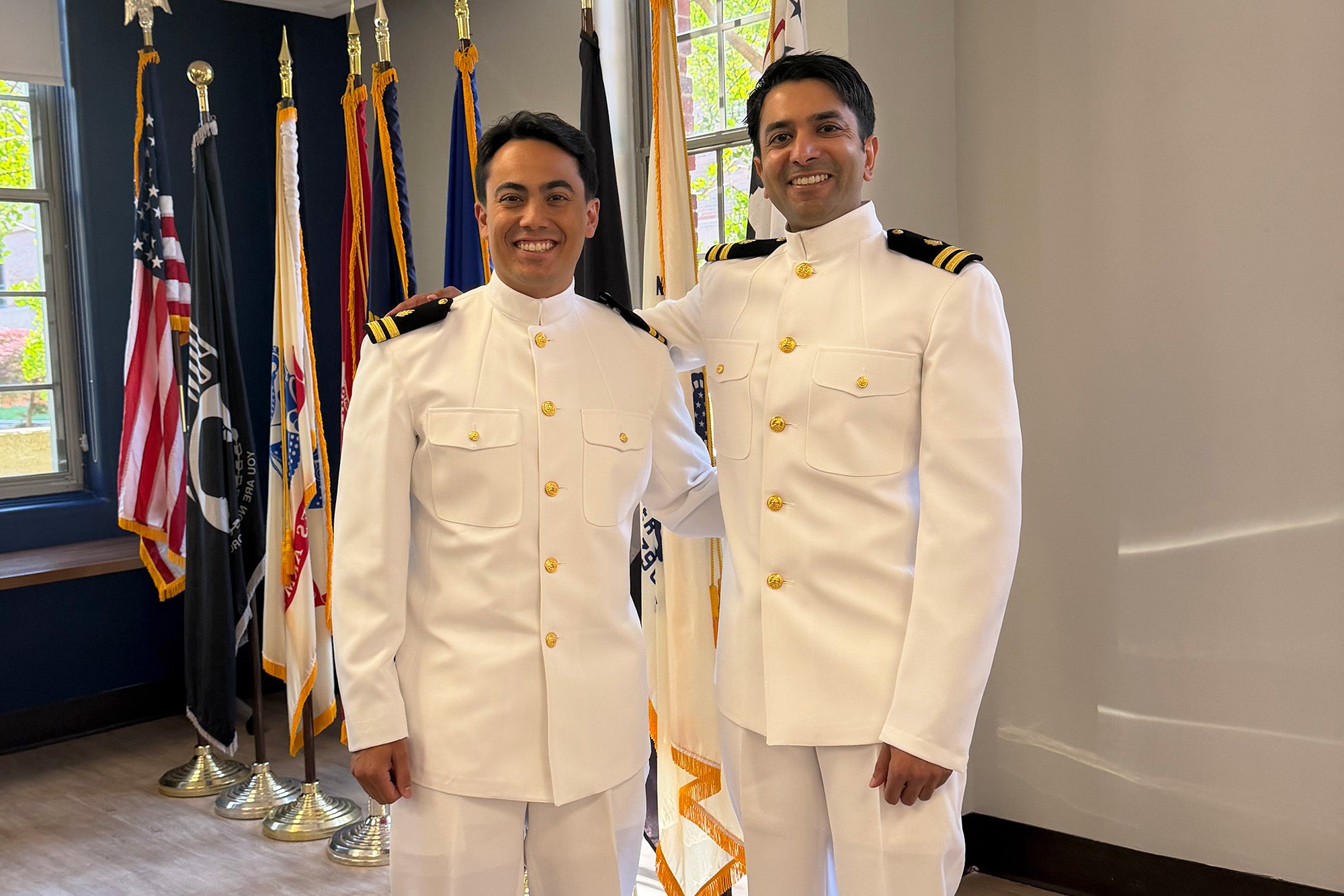 Two students in Navy dress whites stand together