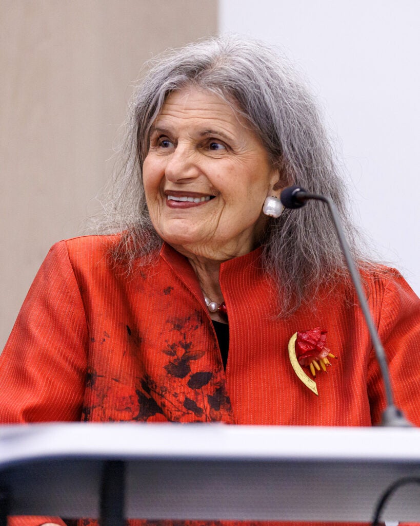 Phyllis Magrab speaks from a podium